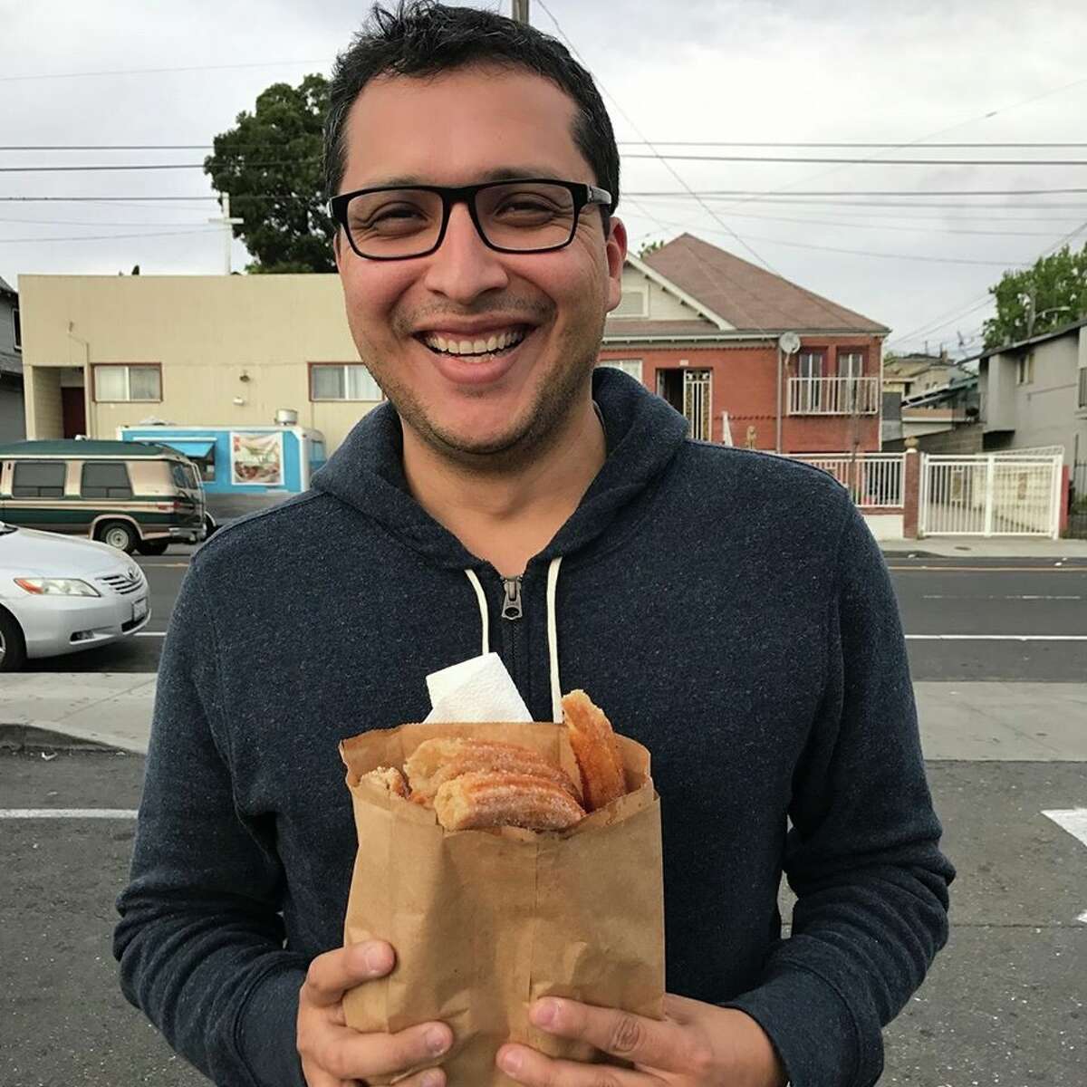 Photographer Eddie Hernandez calls this candid photo of himself, taken by his girlfriend, a good example of how he might capture a client in a dating app profile photo. "I would make sure to use a caption to provide additional context i.e., I know where to find the best churros in all the Bay Area," Hernandez said. See the next three photos for more examples of what Hernandez recommends in profile pics.