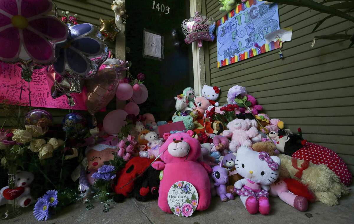 Balloons, flowers, and stuffed animals fill the entrance to Maleah Davis' apartment Monday, May 20, 2019, in Houston. Maleah has been missing since early May, after her mother's boyfriend, Darien Vence, reported that she was abducted by three men. Police said that story later fell apart, and Vence is now accused of tampering with a corpse after blood linked to Maleah was found in his southwest Houston apartment.