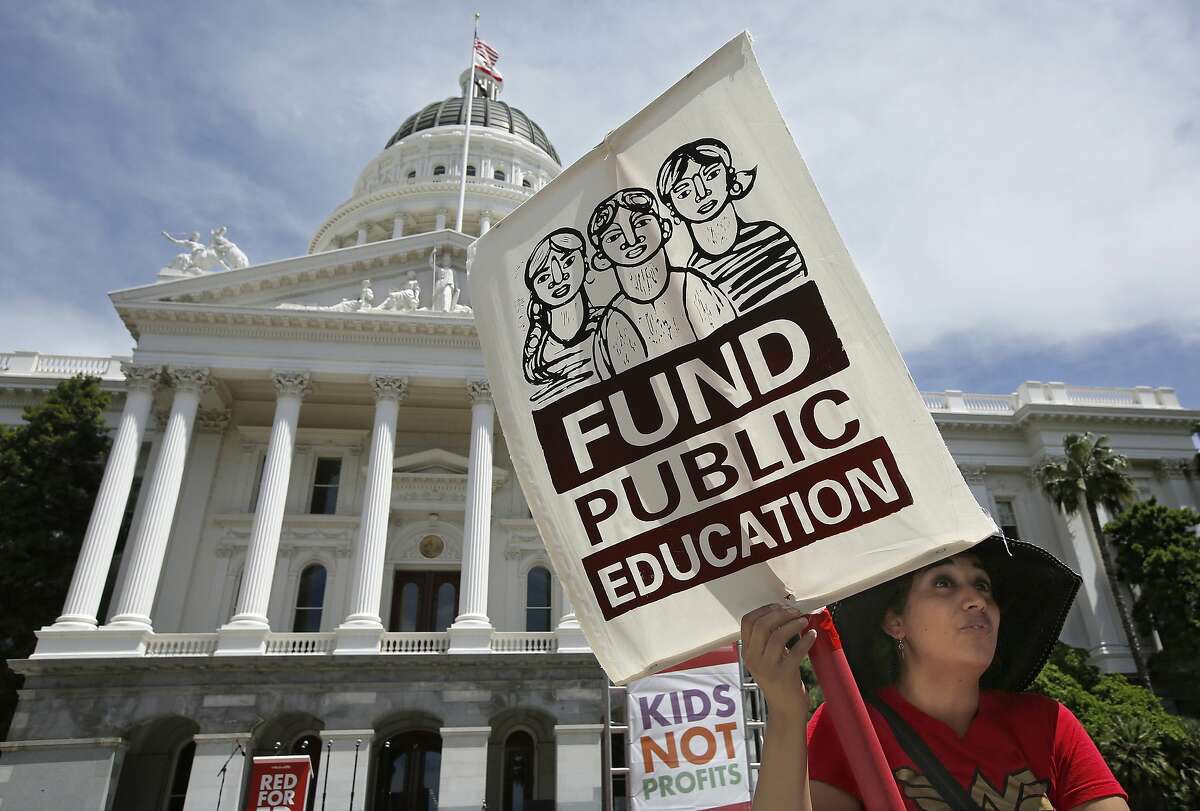 Mayra Joseph, a teacher at Sylvia Menez Elementary School in Berkeley, joined members of the California Teachers Association and supporters of public education in a march to the Capitol as part of RedForEd Day of Action Wednesday, May 22, 2019, in Sacramento, Calif. The marchers were calling on lawmakers to increase funding for public schools. On Wednesday, the state assembly narrowly passed a bill backed by teachers unions to change how charter schools are approved. (AP Photo/Rich Pedroncelli)