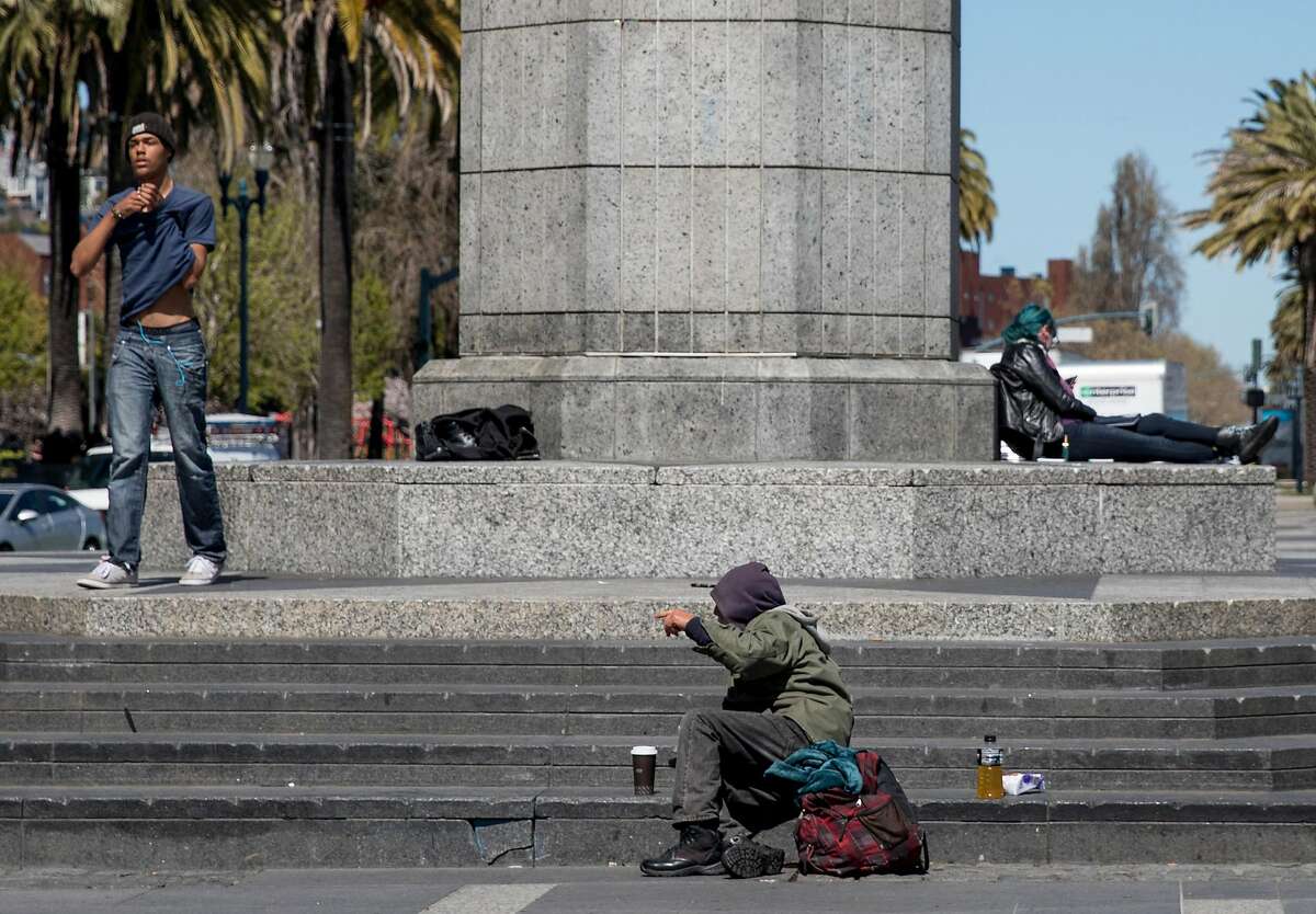 A homeless man sits on the steps of Harry Bridges Plaza along the Embarcadero in San Francisco, Calif. Sunday, April 7, 2019.
