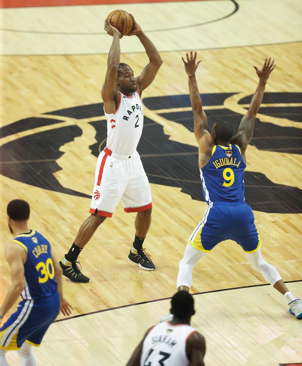 Golden State Warriors’ Andre Iguodala guards Toronto Raptors’ Kawhi Leonard in the first quarter during game 1 of the NBA Finals between the Golden State Warriors and the Toronto Raptors at Scotiabank Arena on Thursday, May 30, 2019 in Toronto, Ontario, Canada.