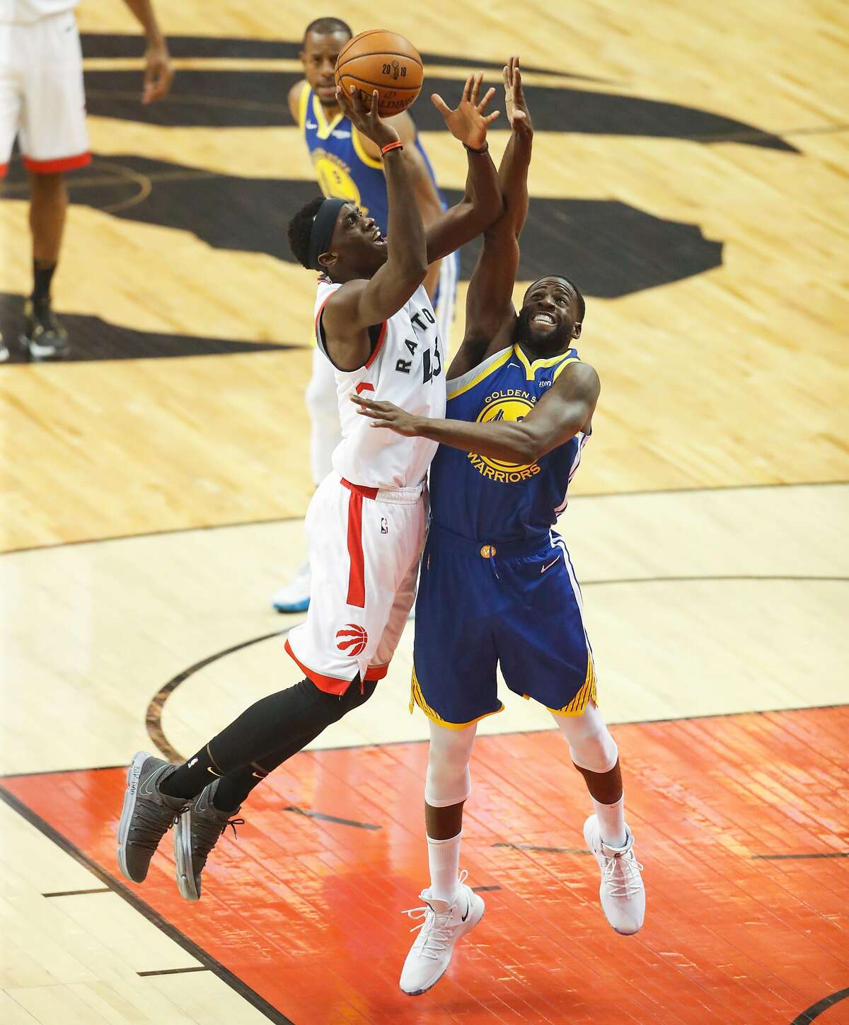 Toronto Raptors’ Pascal Siakam shoots over Golden State Warriors’ Draymond Green in the first quarter during game 1 of the NBA Finals between the Golden State Warriors and the Toronto Raptors at Scotiabank Arena on Thursday, May 30, 2019 in Toronto, Ontario, Canada.