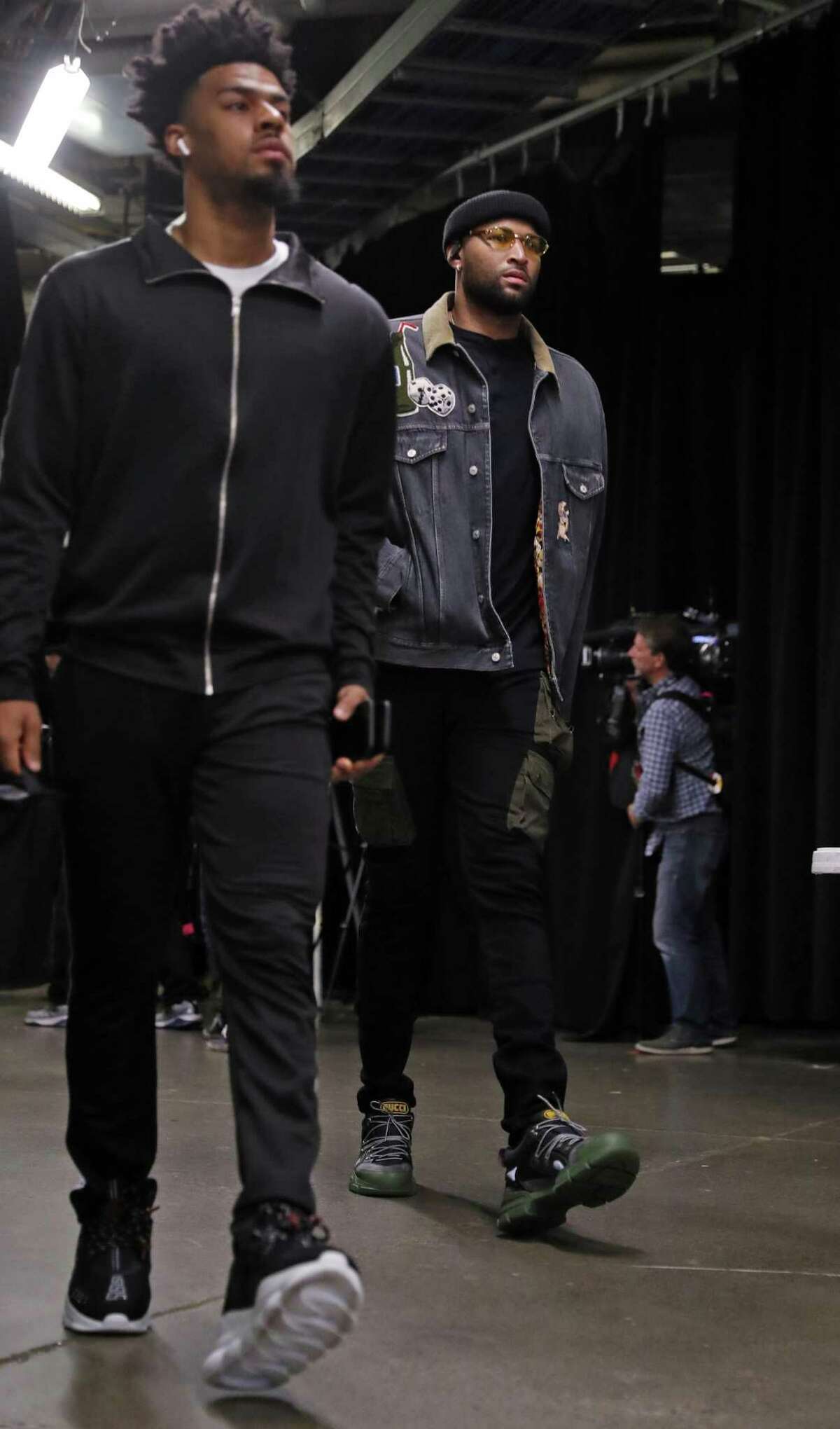 FILE - Golden State Warriors' DeMarcus Cousins and Quinn Cook arrive before NBA Finals' Game 1 at ScotiaBank Arena in Toronto, Ontario, Canada, on Thursday, May 30, 2019.