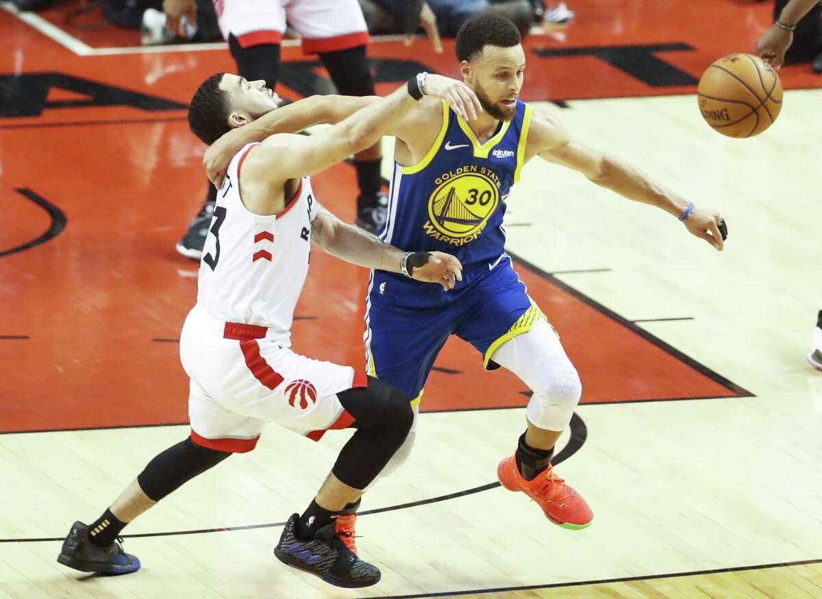 Golden State Warriors’ Stephen Curry goes after a loose ball against Toronto Raptors’ Fred VanVleet in the second quarter during game 1 of the NBA Finals between the Golden State Warriors and the Toronto Raptors at Scotiabank Arena on Thursday, May 30, 2019 in Toronto, Ontario, Canada.