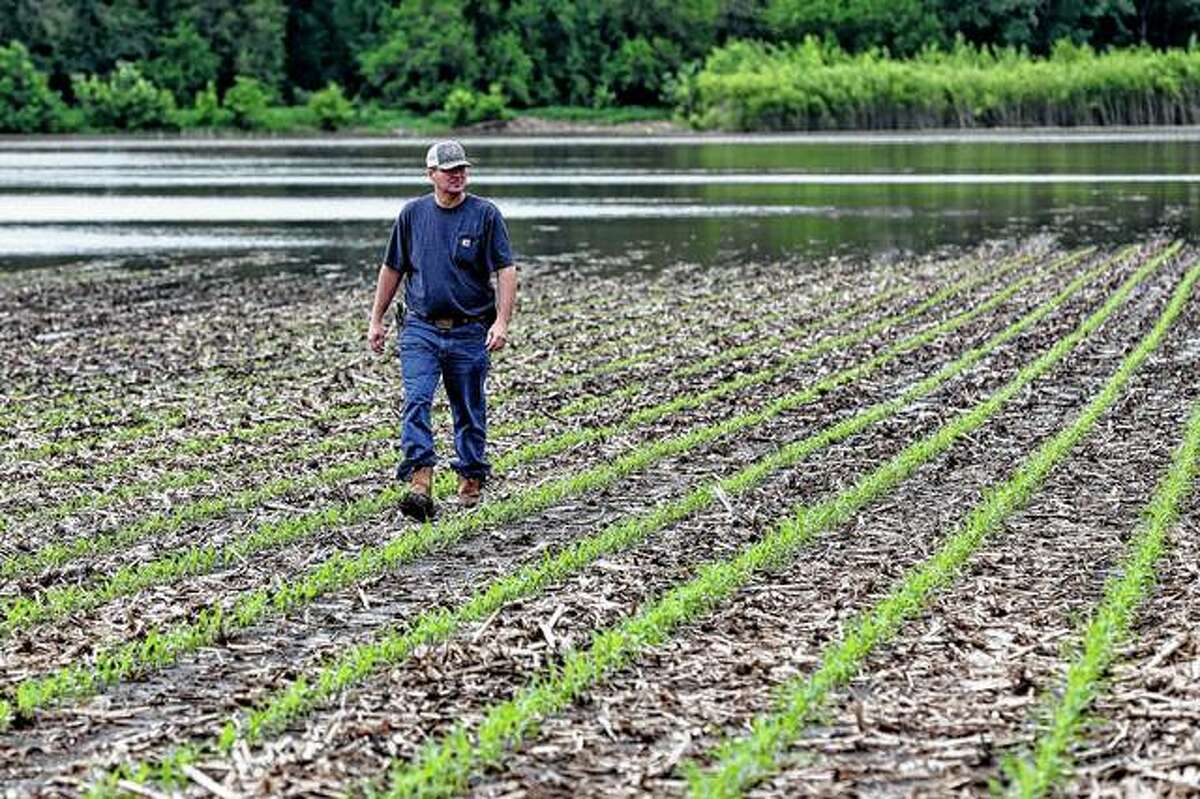 Jeff Jorgenson looks Wednesday over a partially flooded field he farms near Shenandoah, Iowa. About a quarter of his land has been lost this year to Missouri River flooding, and much of his remaining property has been inundated with heavy rain and water from the neighboring Nishnabotna River.