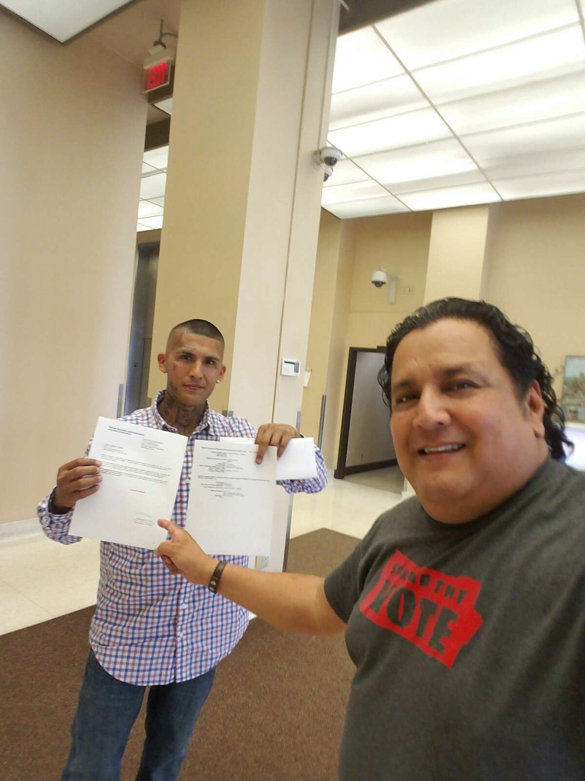 Christopher Torres holds up the important documents he got with the help of Ramon Chapa Jr. on Tuesday, May 28.