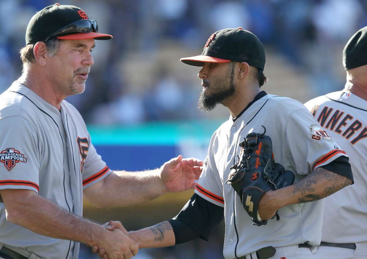 Sergio Romo gives Bruce Bochy some pricey tequila as a retirement gift