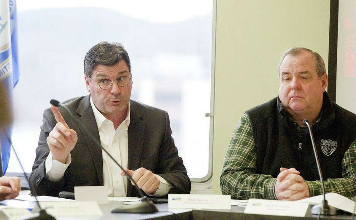 Rick Dunne, executive director of the Naugatuck Valley Council of Governments, left, answers questions as Waterbury Mayor Neil M. O’Leary, right, looks on. O’Leary is one of seven white males likely to be running the state’s largest cities after the November election.