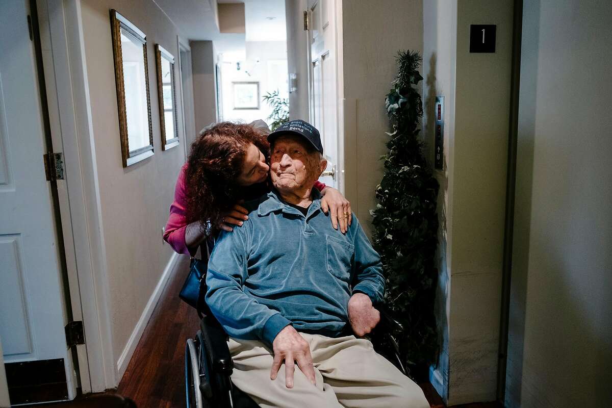 Bernd Stevens gets a kiss from his daughter Jana King as she helps him out of his room for lunch at his assisted living home in South San Francisco, Calif, on Wednesday, May 29, 2019. 98-year-old Bernd Stevens will receive a Congressional Medal of Honor from Congresswoman Jackie Speier to recognize his efforts in helping found the famed OSS, Office of Strategic Services, a precursor to the CIA, during World War II.