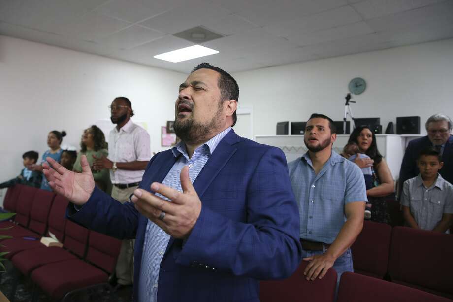 Pastor Erbey Valdez prays during a worship service at New Spirit Church in San Antonio. In 2010, Valdez pleaded guilty to felony charges of having sex with a 17-year-old girl when he was a middle school principal in Sonora, Texas. As a registered sex offender, he founded New Spirit in October of last year. The Southern Baptists of Texas Convention removed the church from its membership in April. (Jerry Lara, Staff photographer | Express News)