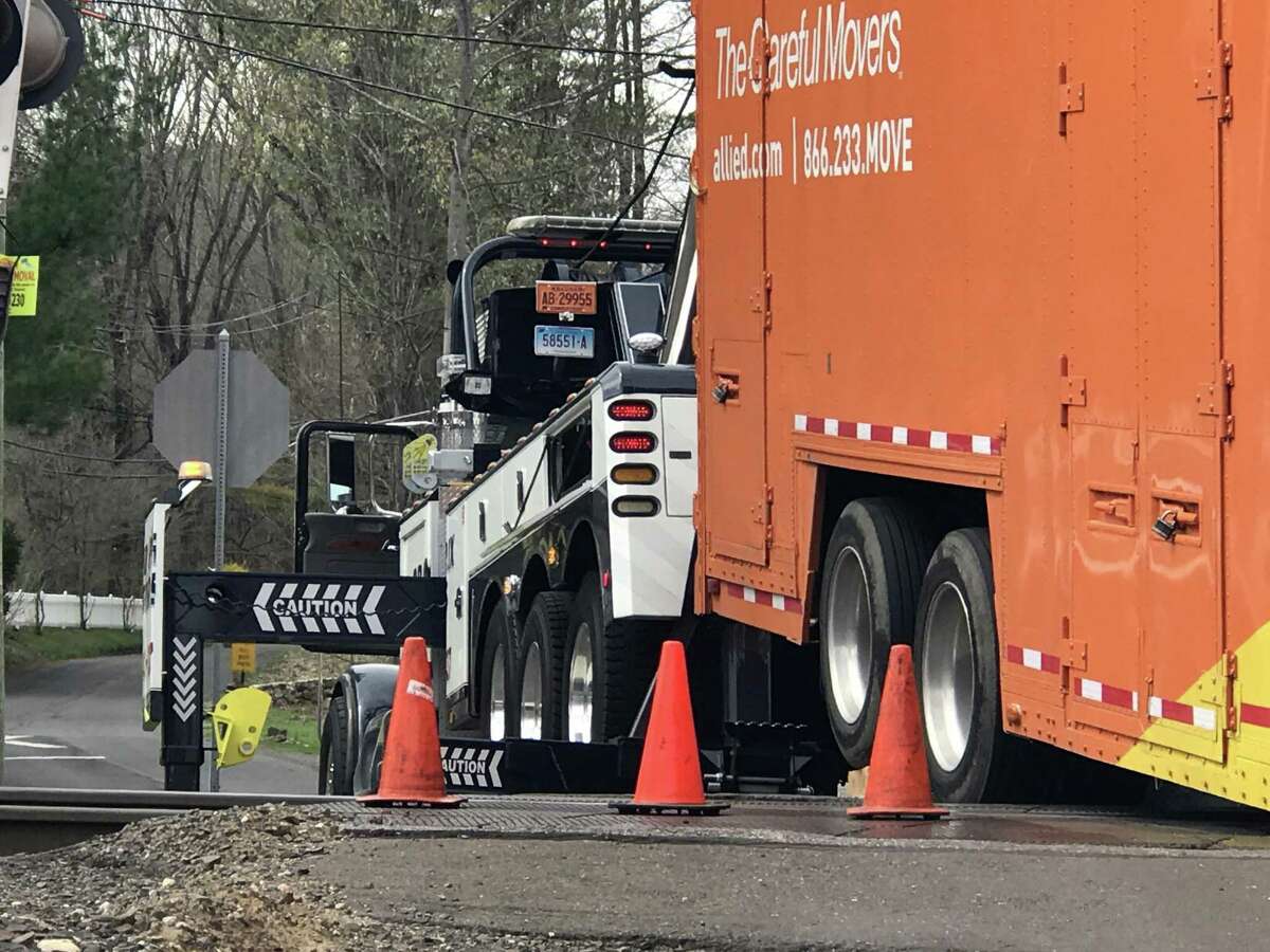 Moving truck stuck on track crossing at Long Ridge Rd. and Simpaug Tkpe, near the West Redding Metro North train station, on Monday, April 17, 2017, in Redding, Conn. Metro North Danbury line service is delayed.