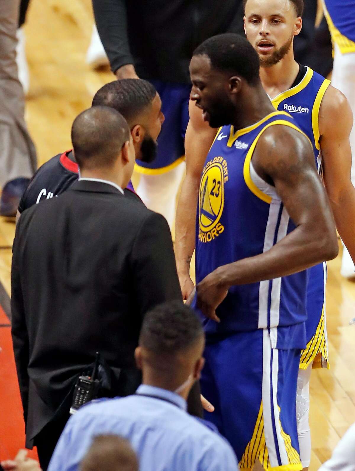 Drake and Golden State Warriors' Toronto Raptors' Draymond Green exchange words after Toronto's 118-109 win in NBA Finals' Game 1 at ScotiaBank Arena in Toronto, Ontario, Canada, on Thursday, May 30, 2019.