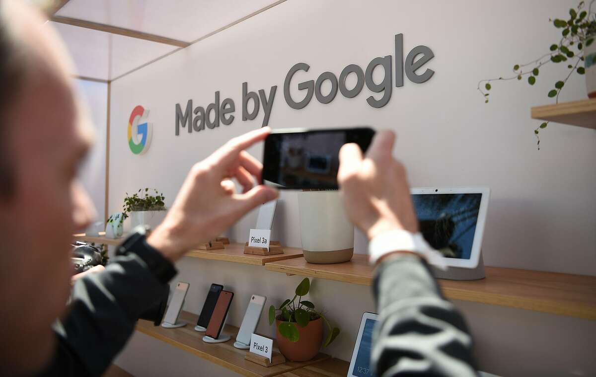 A man takes a photo of new Google products on display during the Google I/O conference at Shoreline Amphitheatre in Mountain View, California on May 7, 2019. (Photo by Josh Edelson / AFP)JOSH EDELSON/AFP/Getty Images