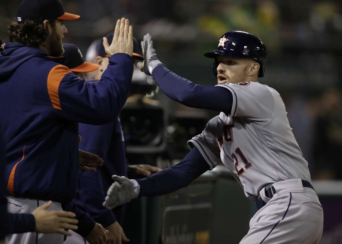 Houston Astros' Derek Fisher, right, is congratulated after hitting a home run off Oakland Athletics' Lou Trivino during the eighth inning of a baseball game Friday, May 31, 2019, in Oakland, Calif. (AP Photo/Ben Margot)