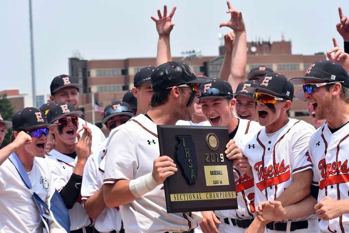 Drake Westcott, holding the plaque, and the Edwardsville Tigers celebrate their win over Normal West on Saturday to win the Class 4A Illinois Wesleyan Sectional championship.