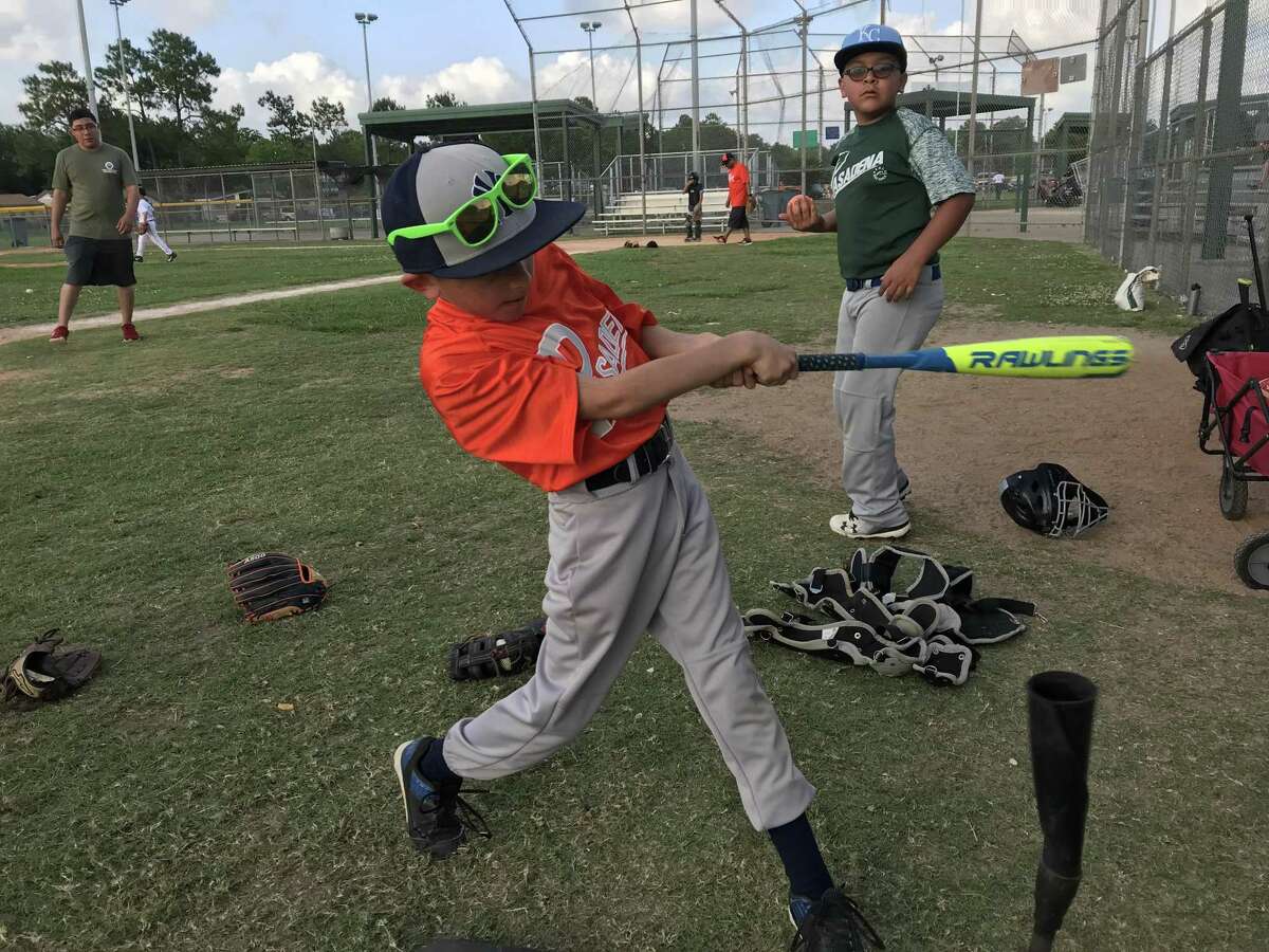 Pasadena 10U all-star Bentley Canizales works on hitting balls off a tee during a team practice at Strawberry Park this past week. The team is slated to begin facing opponents over Father's Day weekend.