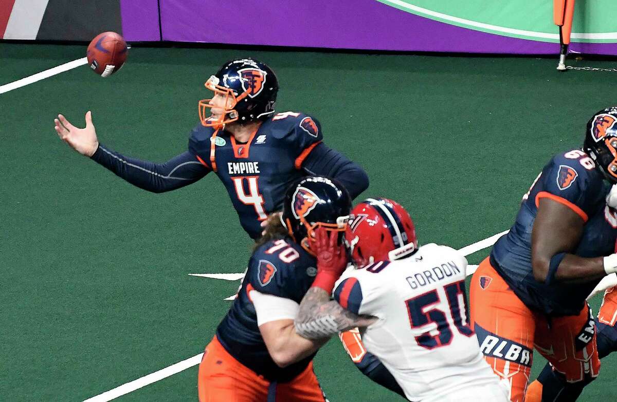 Albany Empire quarterback Tommy Grady (4) bobbles the football during a arena football game against the Washington Valor Saturday, June 1, 2019, in Albany, N.Y. (Hans Pennink / Special to the Times Union)