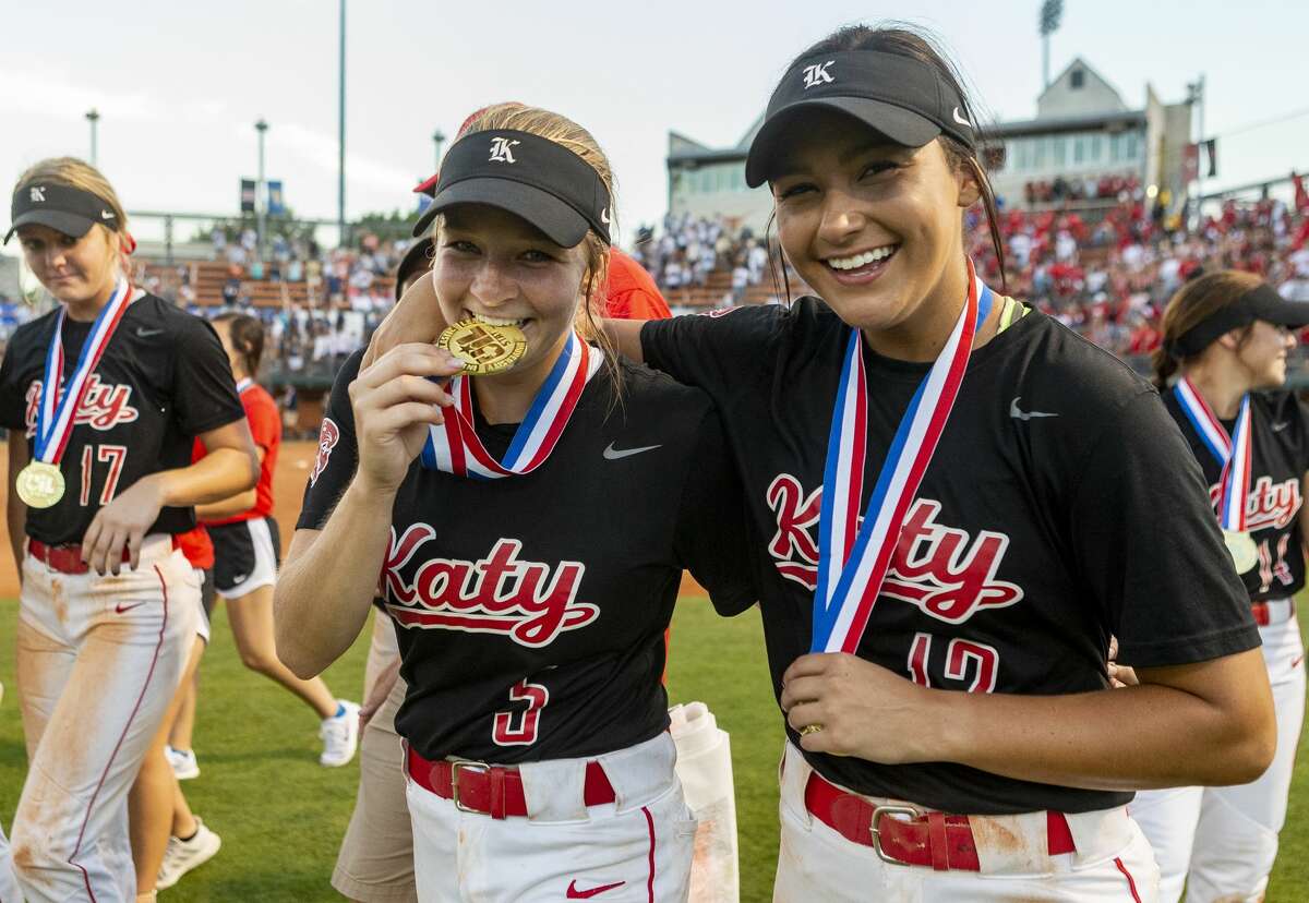 Katy short stop Chloe Woodward (5) and second baseman Amy Hitt (12) celebrate a 8-2 win over Klein Collins with their gold medals during the UIL Class 6A state softball championship in Austin, Saturday, June 1, 2019. (Stephen Spillman / for Houston Chronicle)