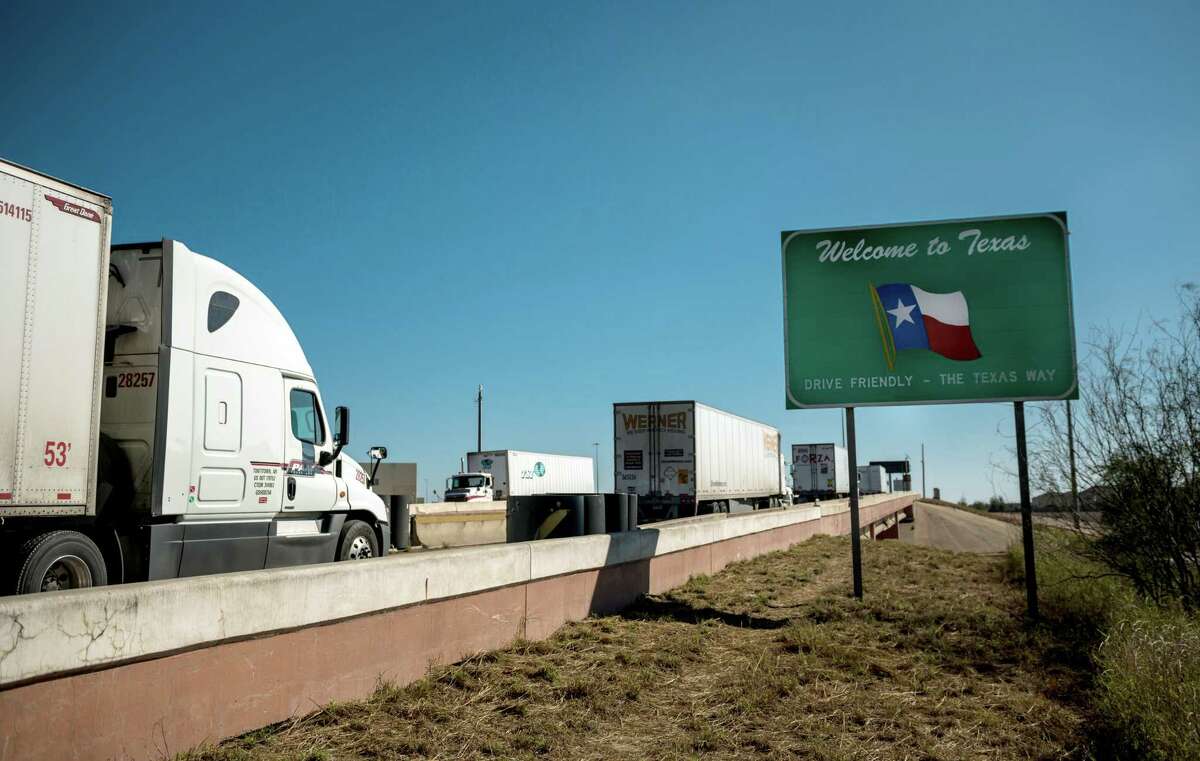 FILE -- Trucks enter Laredo, Texas, after crossing from Nuevo Laredo, Mexico, Jan. 12, 2019. President Trump said Thursday, May 30, 2019, that he would impose a 5 percent tariff on all imported goods from Mexico beginning June 10, a tax that would “gradually increase” until the flow of undocumented immigrants across the border stopped. (Meredith Kohut/The New York Times)