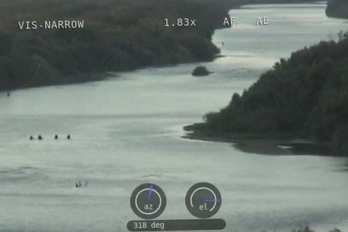 The Webb County Sheriff’s Office said people can be seen in this photo crossing the Rio Grande.