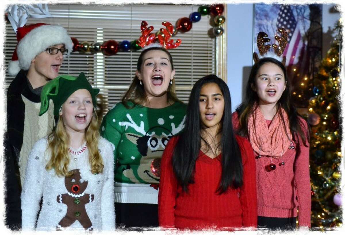 Harrison Gilberti, Cate Wisneski, Sophia Santos, Srishti Pithadia and Elena Kemper sing at the first annual Holly Jolly Show sing at Trumbull Youth Association’s first annual Holly Jolly Show, which brought plenty of holiday cheer at the VFW Center Dec. 19. — Lisa Romanchick photo