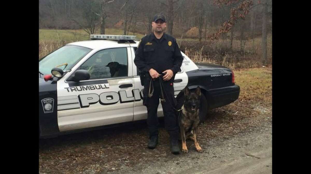Trumbull police officer Greg Lee with K9 officer Storm.