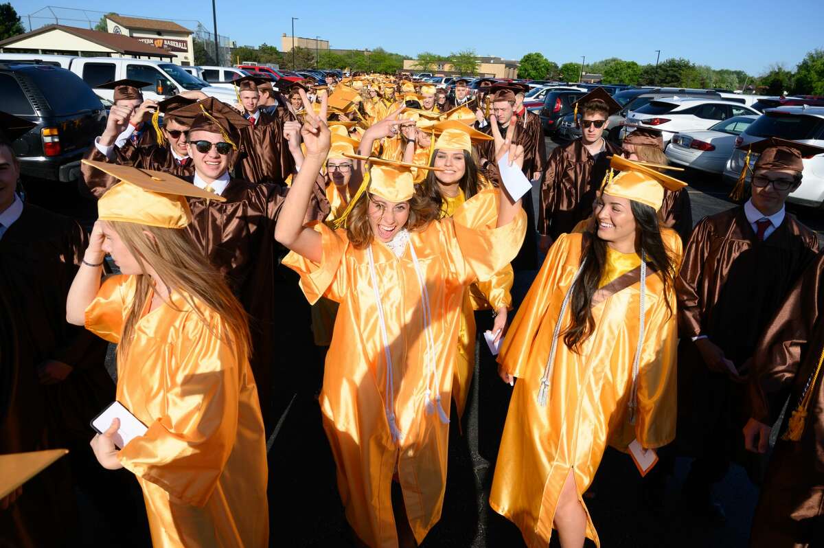 Bay City Western High School students celebrate graduation during their commencement ceremony on Sunday, June 2, 2019 at the school. (Steven Simpkins/for the Daily News)