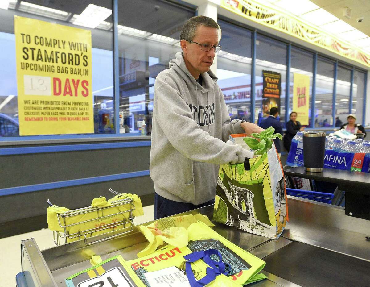 Nick D'Alessan, of Stamford, bags his own groceries using recyclable bags after shopping at ShopRite on Saturday, April 20, 2019 in Stamford.