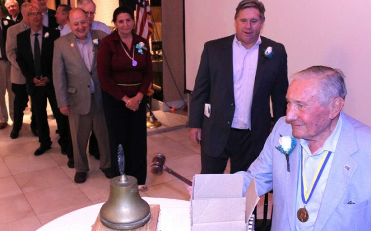 Trumbull Rotary rings the bell and passes the gavel