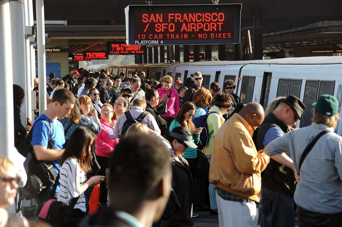 Crowds of commuters wait to board San Francisco bound trains at the MacArthur BART station in Oakland, CA on Friday May 31st, 2013. BART is experiencing severe delays while trains are running single track after two maintenance vehicles collided in the transbay tube, resulting in track damage needing repair.