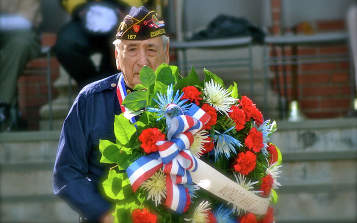 Before the parade began, those who served were honored at a ceremony at Town Hall, which included a Presentation of the Wreaths ceremony. (Lisa Romanchick photo)