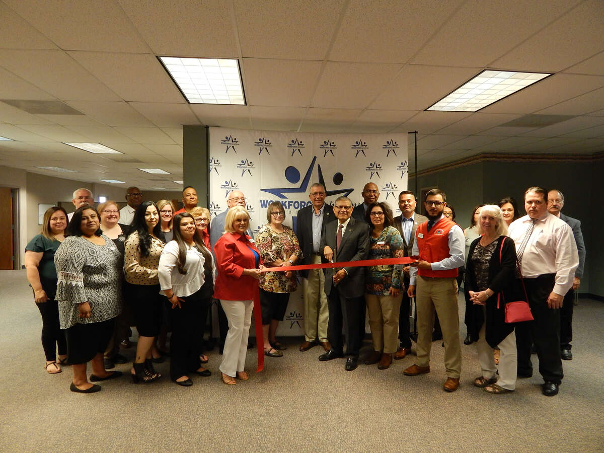 Texas Workforce Solutions South Plains Plainview board members, Plainview Chamber of Commerce Ambassadors and local business leaders cut ribbon at the new Workforce Solutions office to celebrate the change in location.