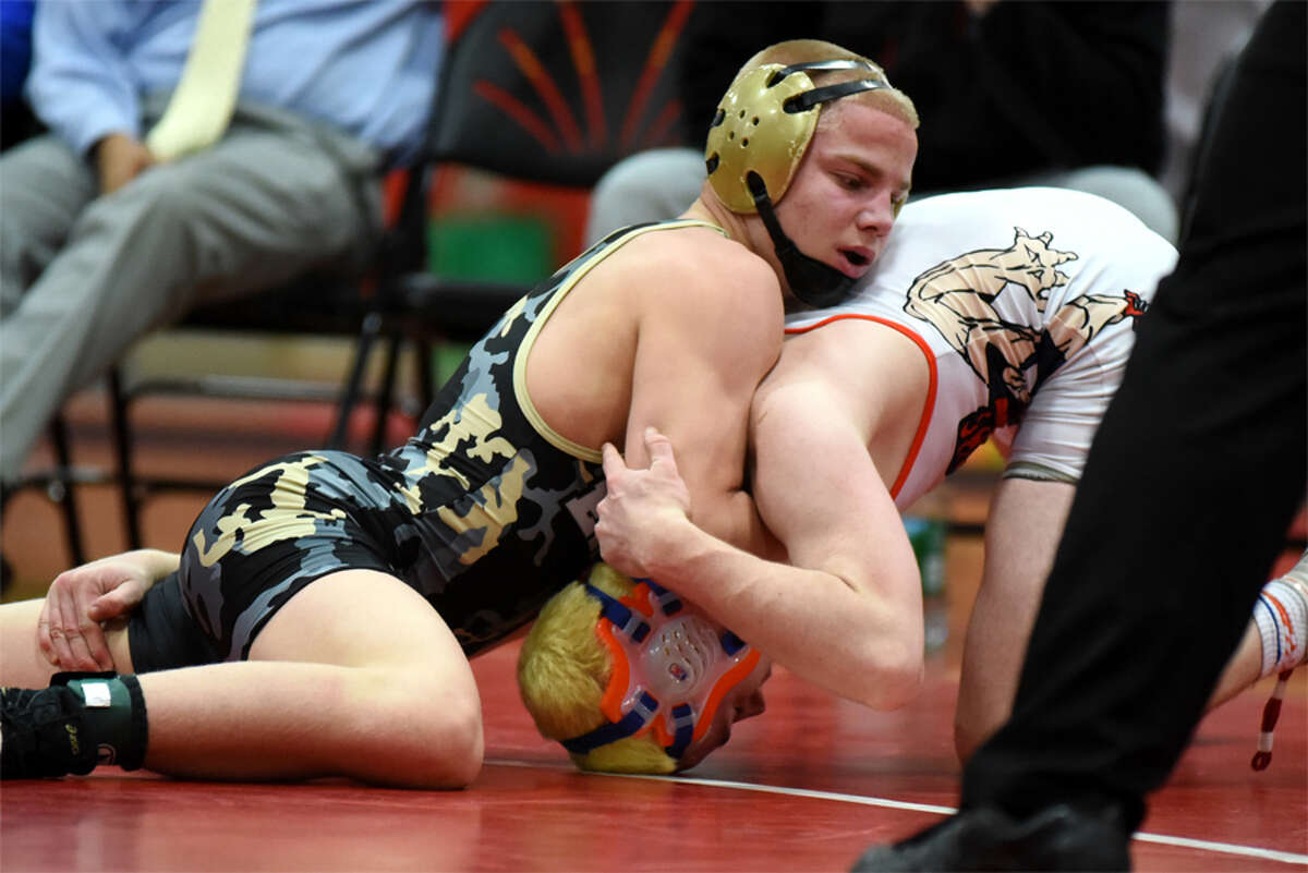 Cross Cannone defeated Danbury's Justin Peterson in the 132-pound weight class final. (Dave Stewart/Hersam Acorn Newspapers Photo)