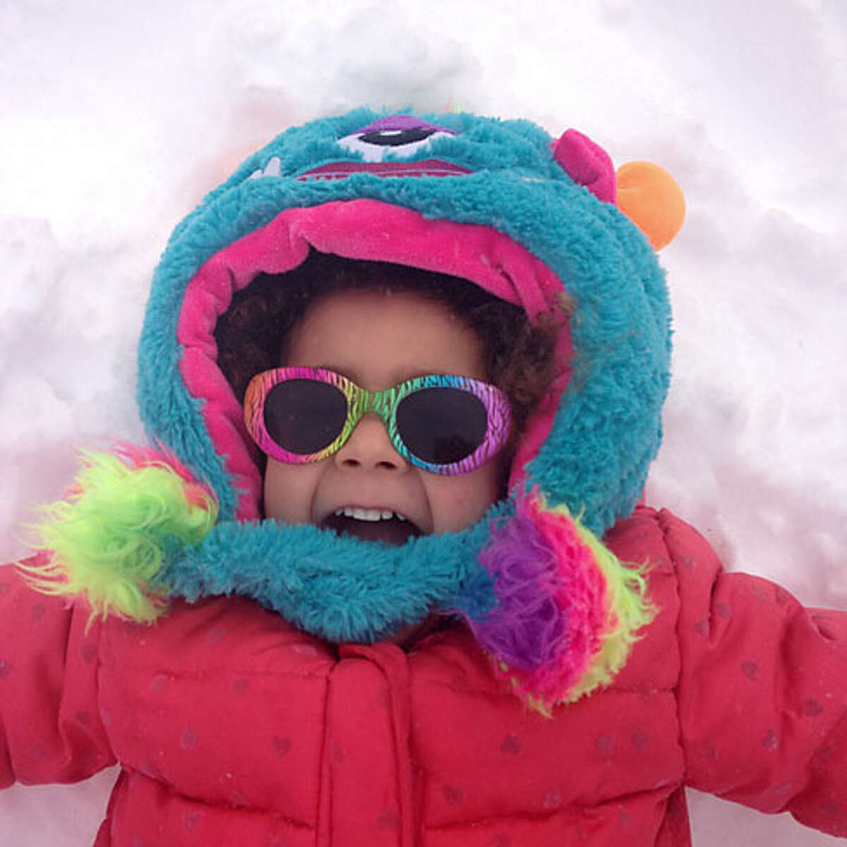 Marley Gipson, 3, brightens up the snow.