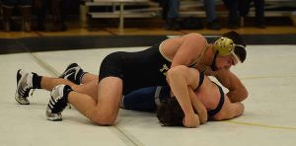 Trumbull's Brian Wallace works towards a pin in his 160-pound match. — Dee Sollenberger photo