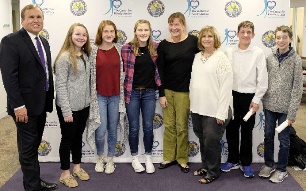 Casey Gwinn, author of Cheering for Children and founder of the Family Justice Center movement with members of the KARE Club at Madison Middle School. From Left to Right: Casey Gwinn, Bailey McGuigan, Katie McLaughlin, Emma LeClerc, Jeanne Malgioglio, Nancy Yarmosh, Shane Miller, and Connor Downs.