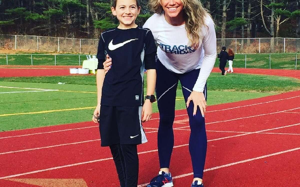 Track Friday coordinator Heidi Langan and her son Jaden Buchetto, 10, at last year’s event.