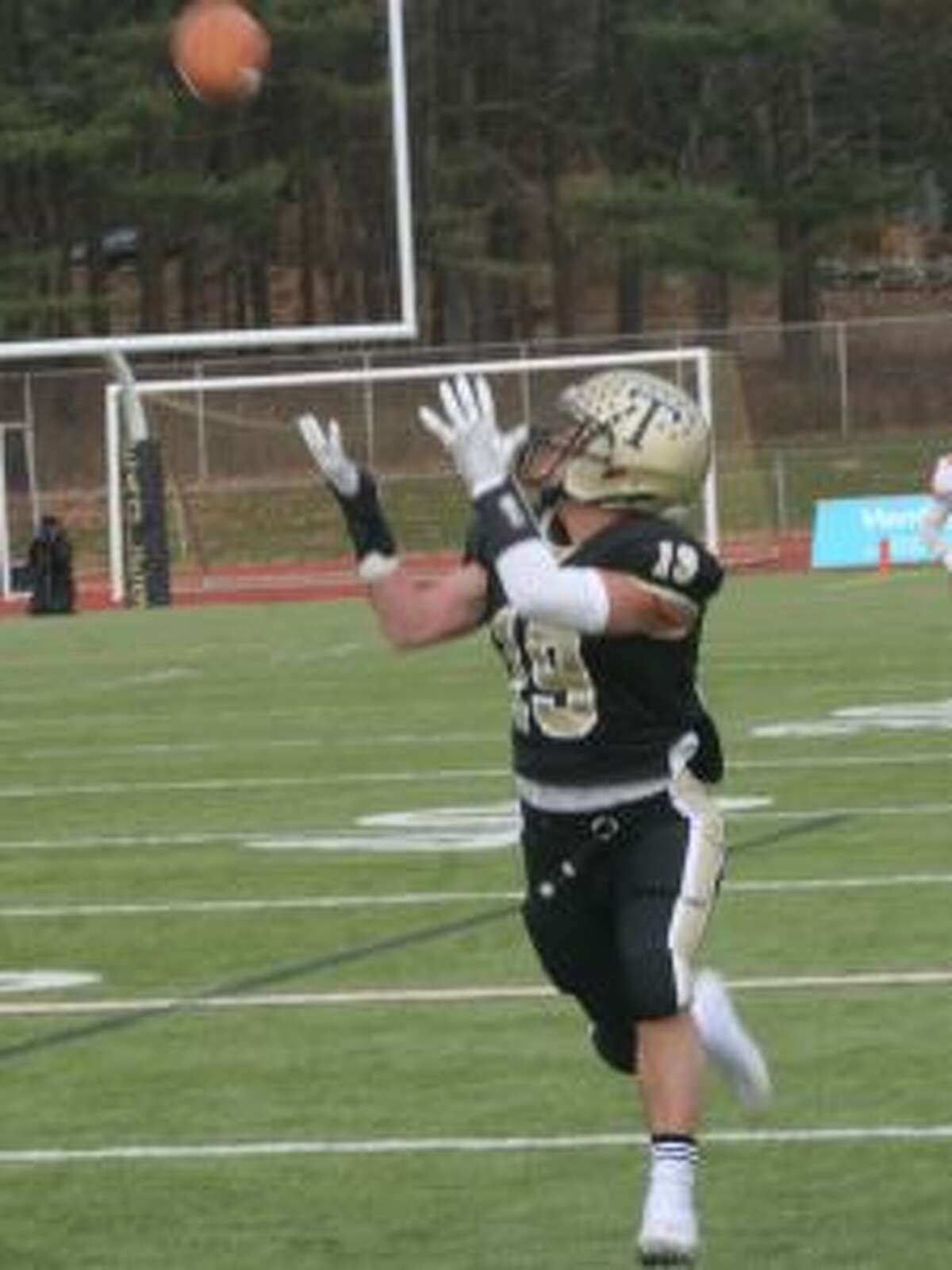 Dustin Siqueira settles under a 63-yard scoring pass from Johnny McElroy