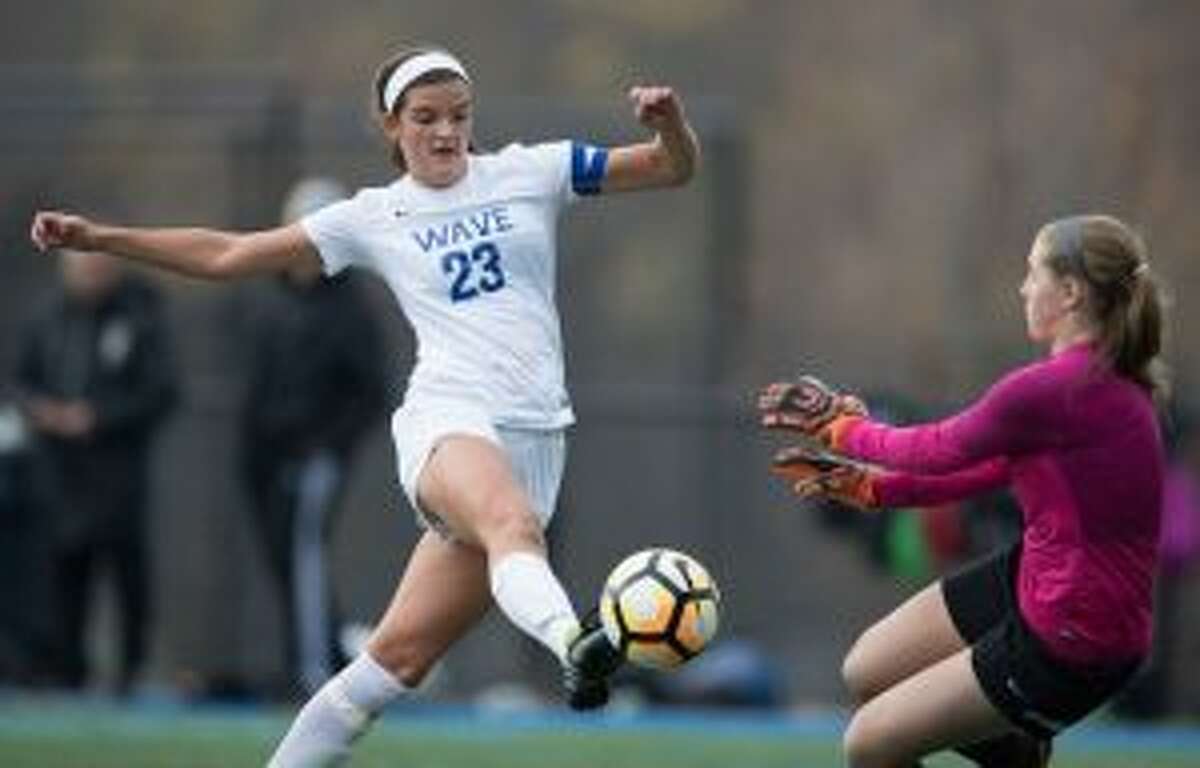 Trumbull keeper Avery Rice stops Darien's Emma Lesko in first half. — Darien Athletic Foundation photo