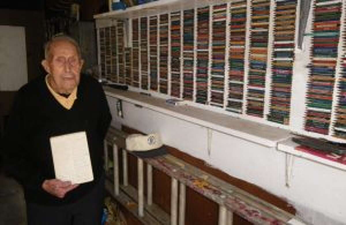 Charlie Clark shows off his golf pencil collection.