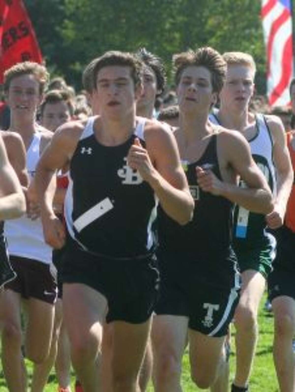 Charlie Taubl looks to close in on a Joel Barlow runner at the Wilton Invitational.