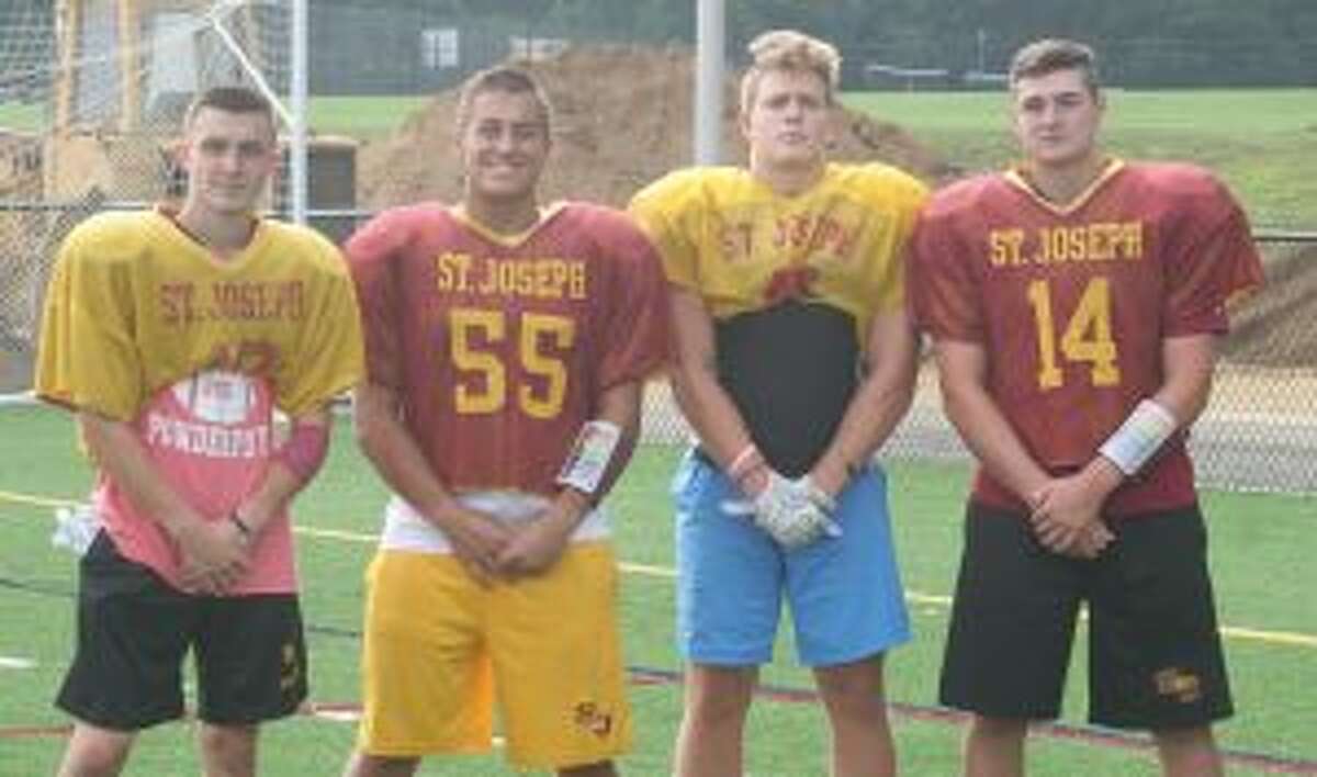 St. Joseph's Nick Osborne, Alec Pelletier, Brian Harner and Cory Babineau are team captains. - Bill Bloxsom photo