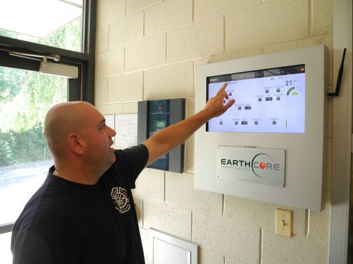 Dave Tiago, the maintenance and facilities manager for the Trumbull Center Fire District, shows off the headquarters’ new Earthcore Energy Services system — better known as “Big Brother” around the firehouse — which controls the White Plains Road building’s heating, ventilation, and air conditioning. — Steve Coulter photo