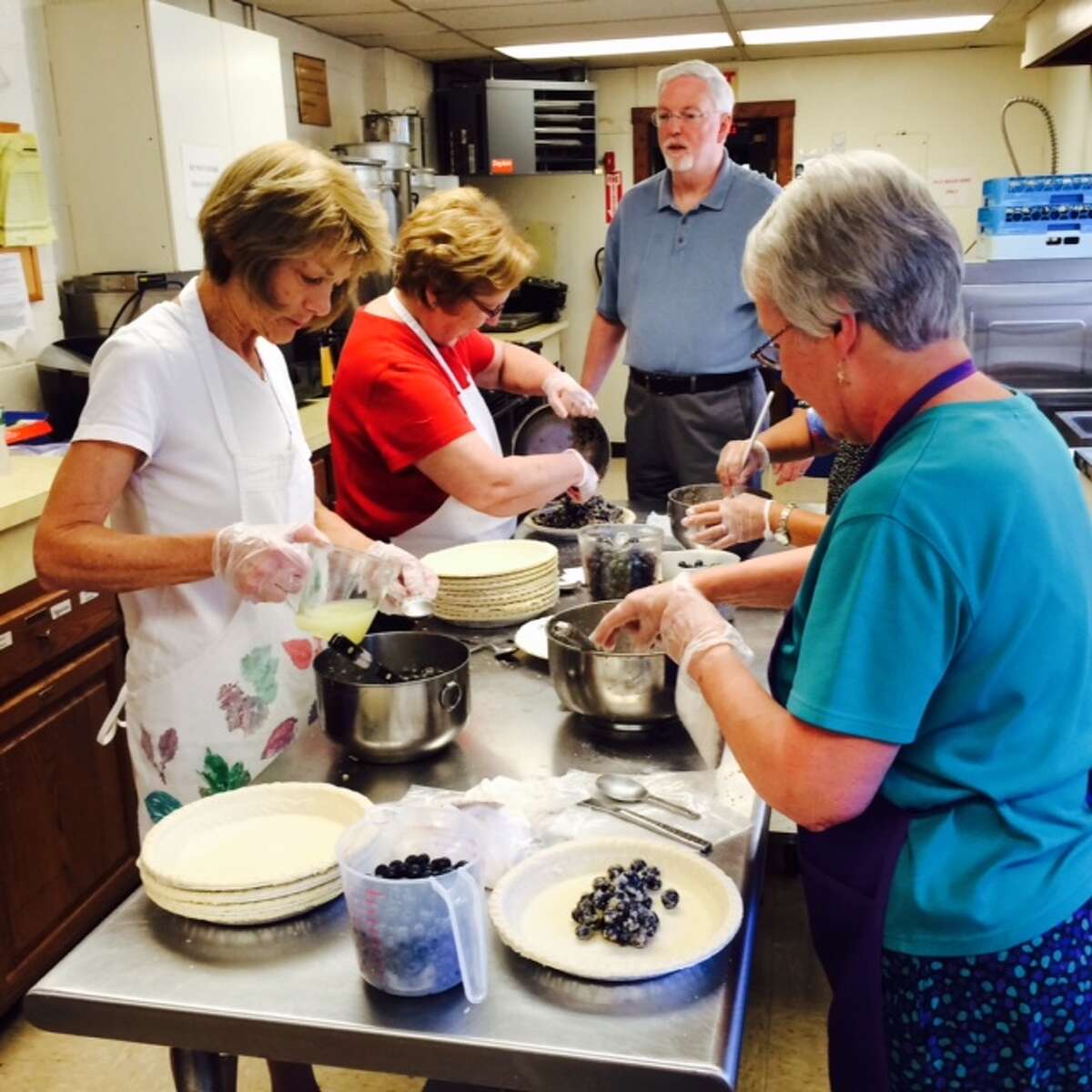 Inside Trumbull’s Long Hill United Methodist Church, blueberry pies are being made for the annual Blueberry Festival. (Blueberry Festival from a previous year).