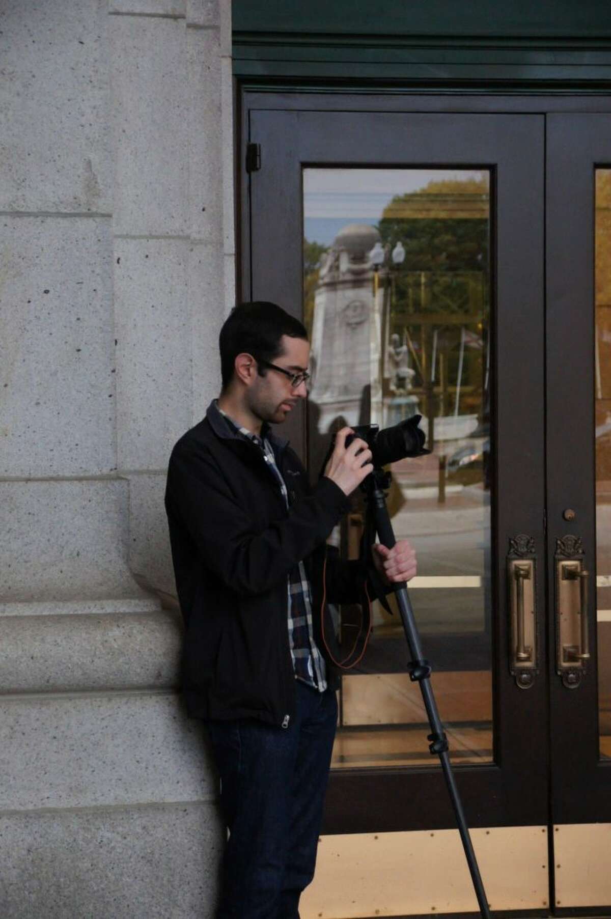 Trumbull resident Kevin Sutherland sets up his camera in the fall of 2013.