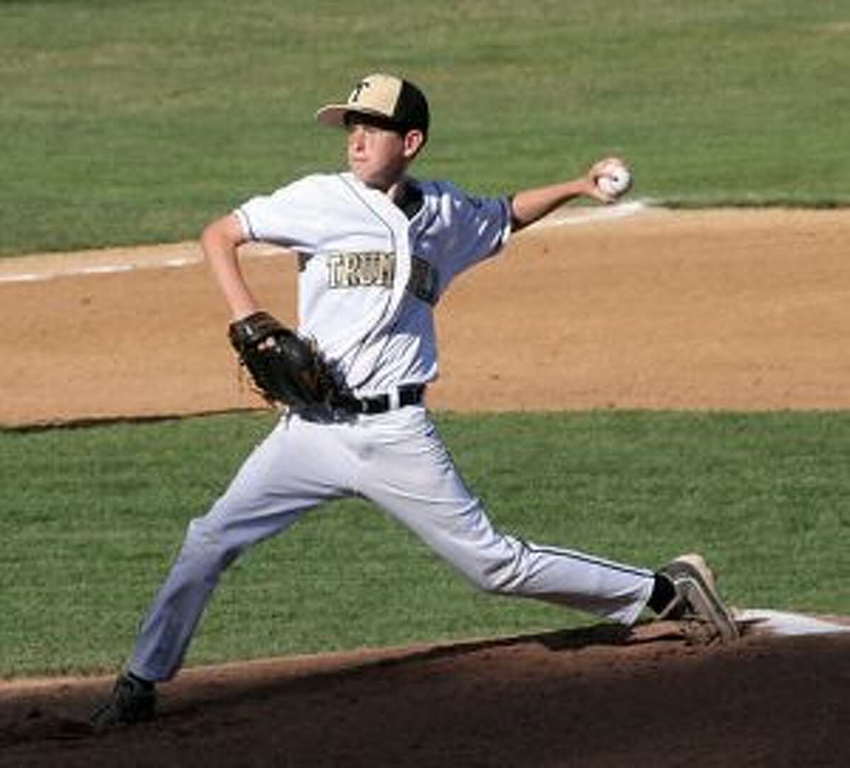 Ryan Carroll delivers a pitch in Trumbull U13's 7-1 win over Simsbury. — Bill Bloxsom photos
