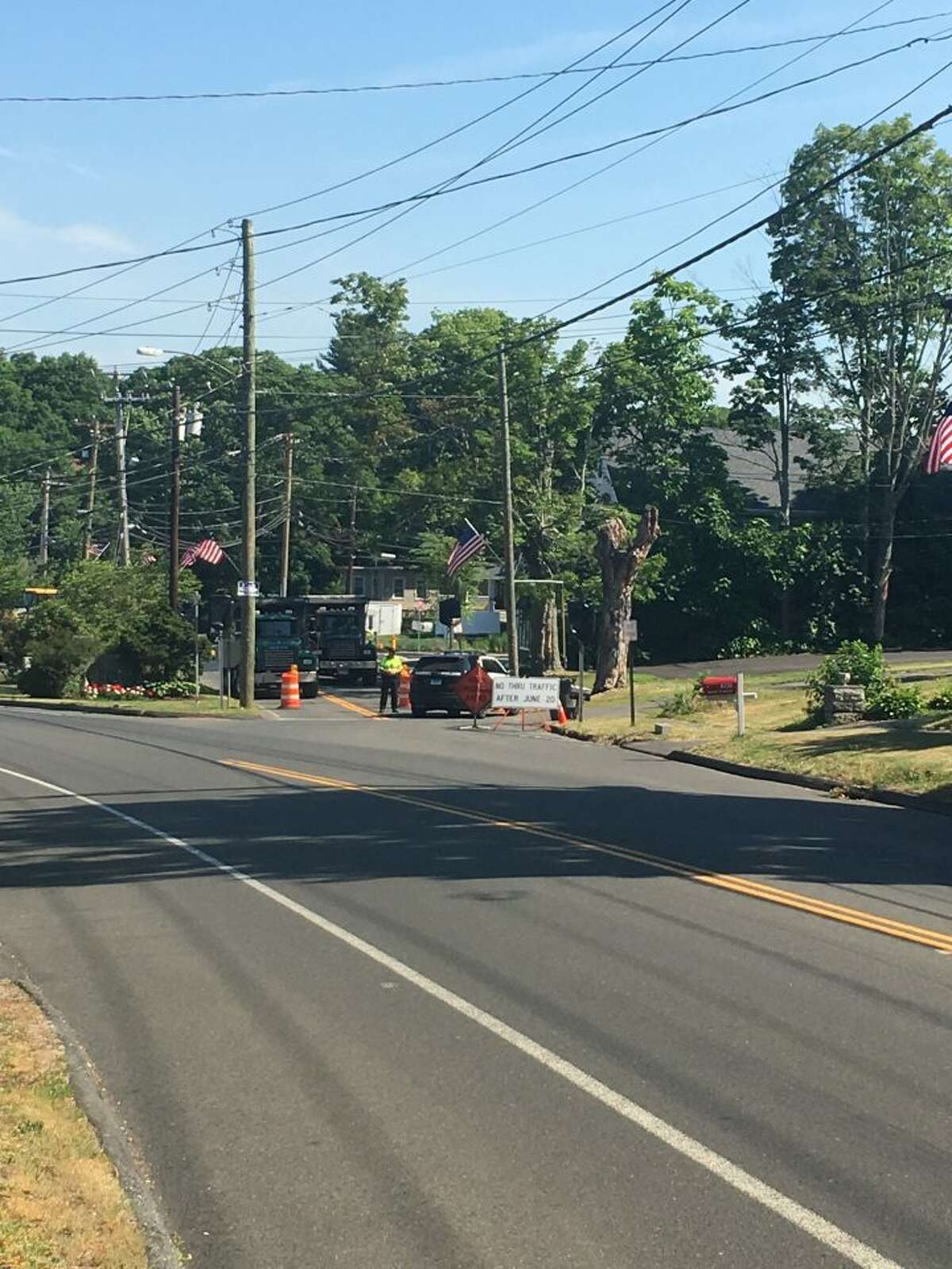 While the curb is currently removed and no traffic changes will be imposed until after the holiday weekend, drivers can expect the intersection to look like it did Monday: trucks and police blocking the northbound entrance. — Steve Coulter