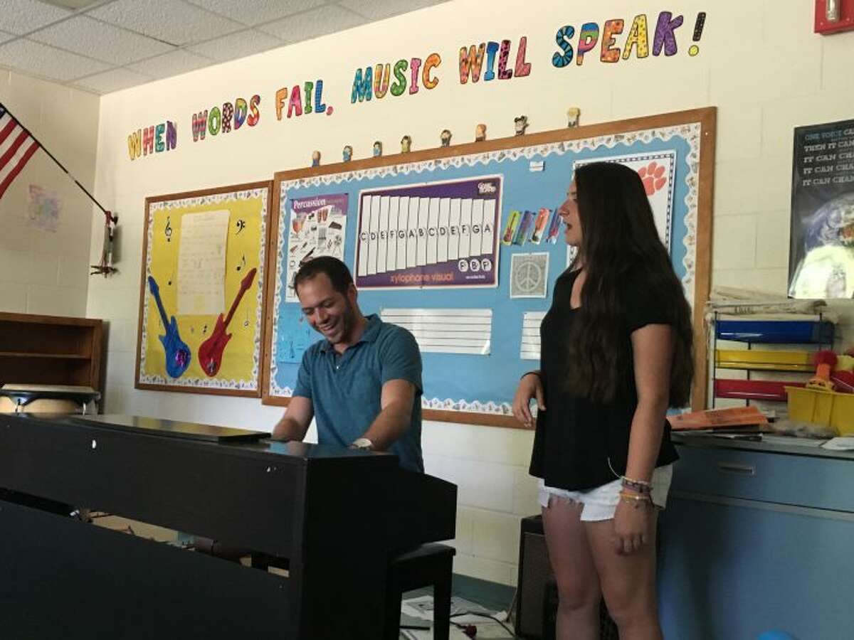 Trumbull High School sophomore Brooklyn Cenatiempo sings “Summer Lover” with her vocal coach and Tashua Elementary School music teacher Tyler Cohen. The duo have produced three songs that are available on the high-school vocalist’s first self-titled album, “Brooklyn.” — Steve Coulter photo