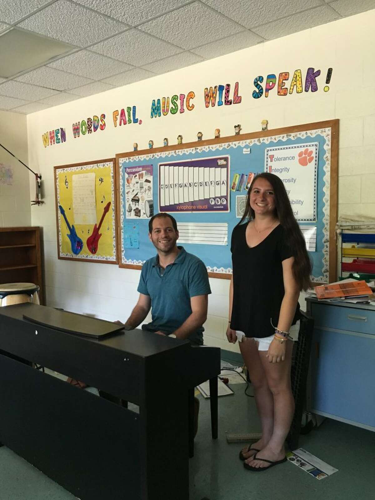 Trumbull High School sophomore Brooklyn Cenatiempo stands with her vocal coach and Tashua Elementary School music teacher Tyler Cohen. The duo have produced three songs that are available on the high-school vocalist’s first self-titled album, “Brooklyn.” — Steve Coulter photo