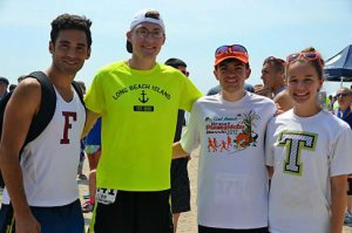 Julian Saad, Matt Ferraro, Shane Romanchick and Kate Romanchick gather after outstanding runs.